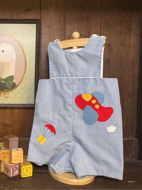 Blue Toddler Romper with airplane and parachute appliqués